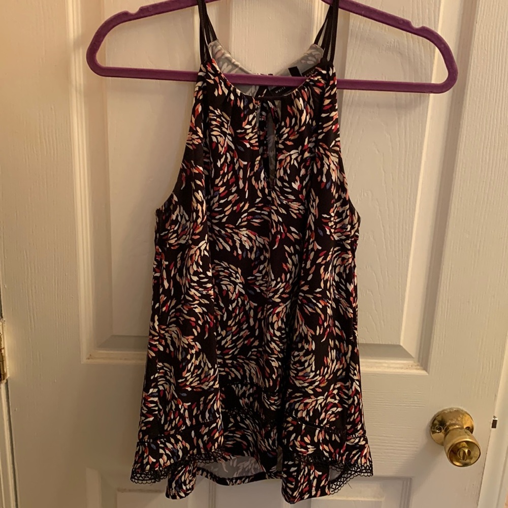 Sleeveless blouse with hem detail